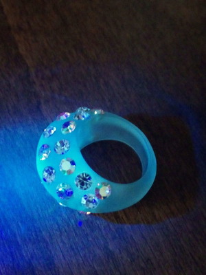 Glow in the dark acrylic ring with iridescent rhinestones used