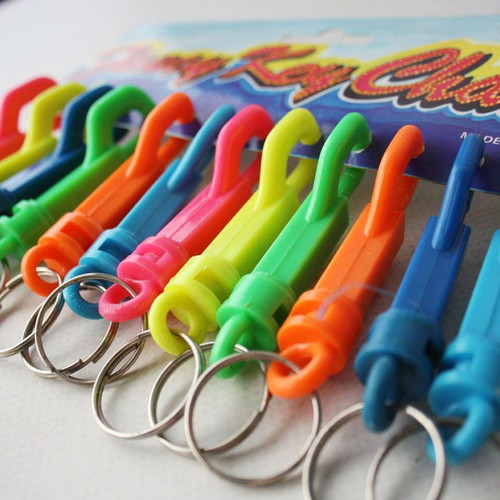 Card with 12 vintage 1980s phosphorescent key chains, new