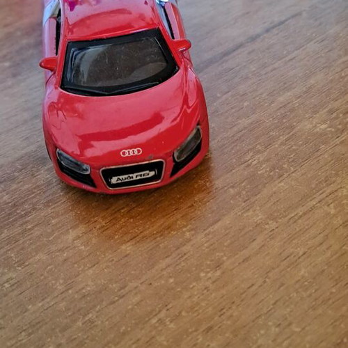 Toy car used, red color