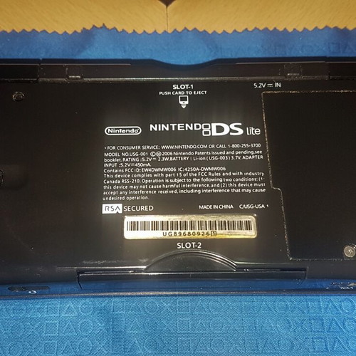 Nintendo DS Lite used with Dialga and Palkia reshell, charger, stylus, and carrying case