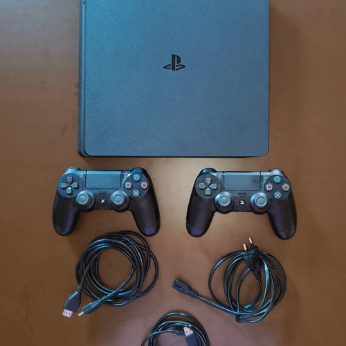 Sony PlayStation 4 Slim 1TB console used with 2 DualShock controllers and 14 games