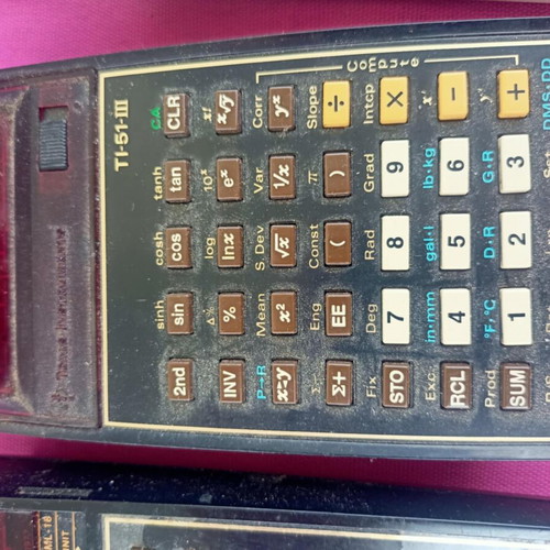Texas Instruments programmable computers used with chargers