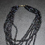 Torsade necklace used with iridescent carnival glass beads, 50cm