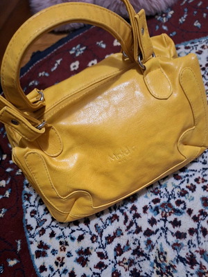 Women's mustard small hand bag used