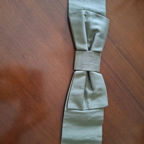 Fabric belt used, green with large bow