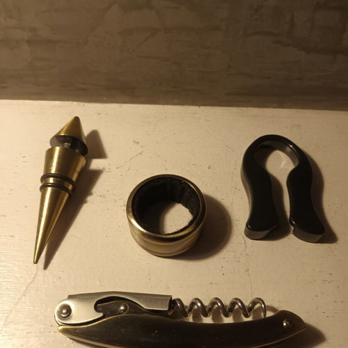 Bottle opening set in rosewood case