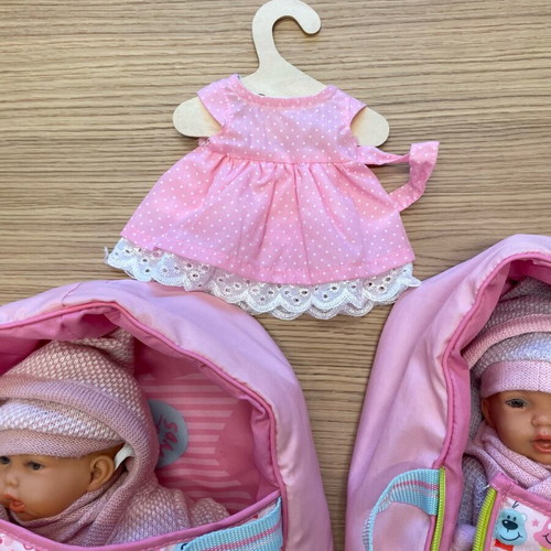 Baby doll like new vinyl with sleeping bag and knitted clothes