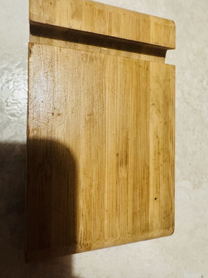 Bamboo phone and tablet stand used with two slots