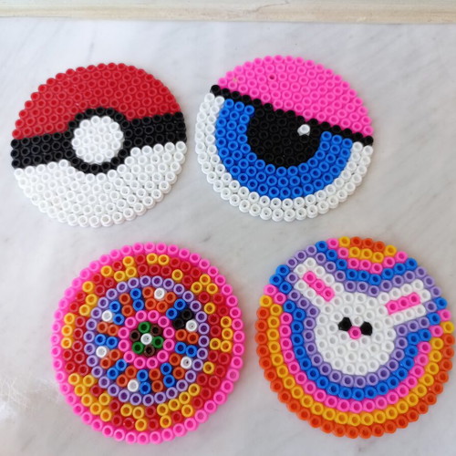 Set of 4 handmade fuse-bead coasters with colorful pixel designs