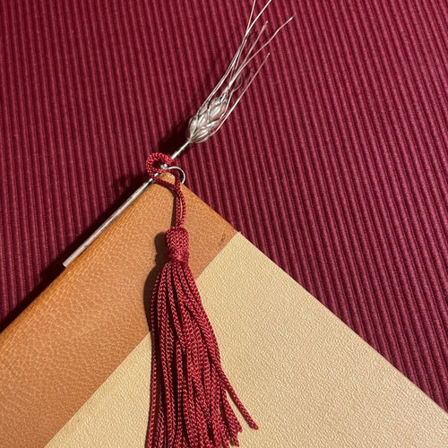Bookmark with decorative silver ear of wheat and red tassel like new