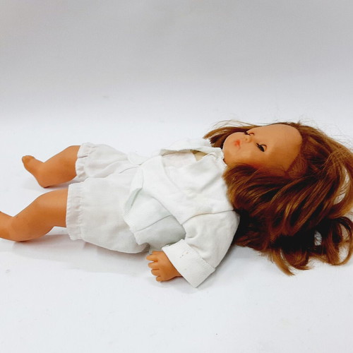 Vintage hard plastic doll with blue sleeping eyes, 1970s