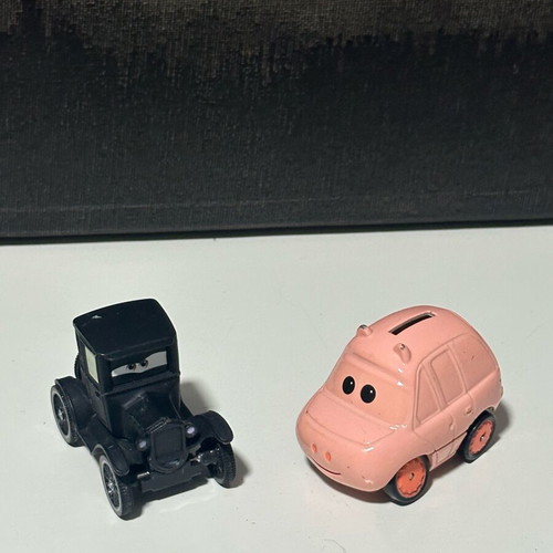 Disney Cars diecast metal toy cars set of 2 like new (black & pink)