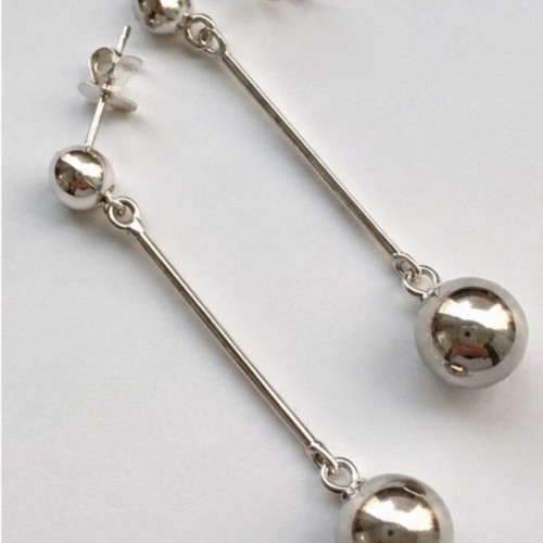 Long geometric drop earrings with silver spheres