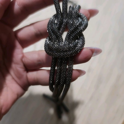 Long silver necklace like new with braid design in the middle