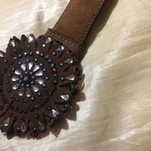 Wide brown suede belt with large buckle and white blue stones