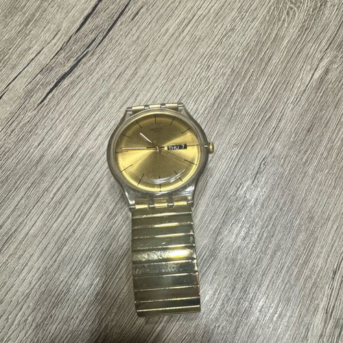 Swatch Dazzling Light χρυσαφί μπρασελέ από ανοξείδωτο ατσάλι μεταχειρισμένο σε καλή κατάσταση