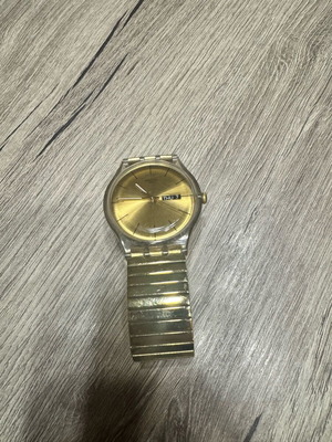 Swatch Dazzling Light χρυσαφί μπρασελέ από ανοξείδωτο ατσάλι μεταχειρισμένο σε καλή κατάσταση