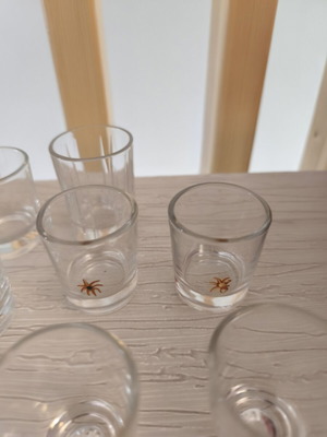 Shot glasses set of 8 with different designs like new