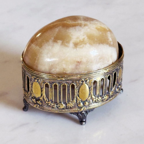 Vintage decorative egg from natural onyx stone in carved silver-plated base used