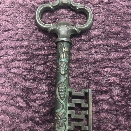 Vintage bottle opener used with patina, brass and steel
