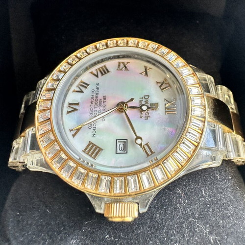Watch with iridescent crystals like new, zircon and gold