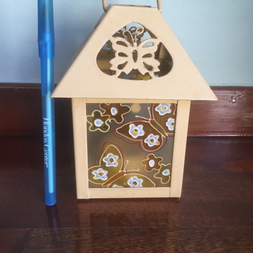 Lantern used with glass panels and embossed butterfly decoration orange-yellow