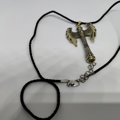 Pendant Double Axe like new, gold-colored steel with black cord