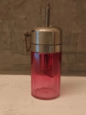Vintage crystal perfume bottle used in amethyst color