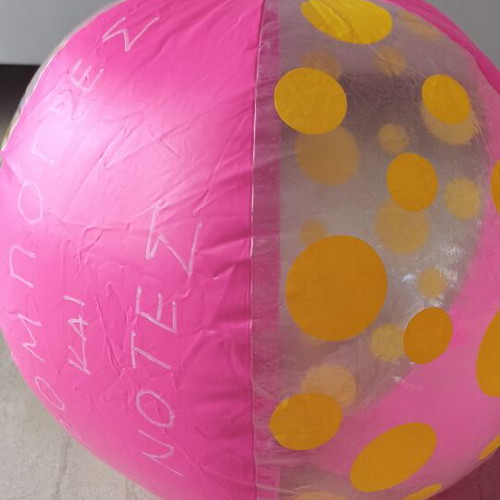 Inflatable beach ball used, pink with yellow dots, 40 cm diameter