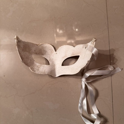 Two ornate masks like new, one gray and one white