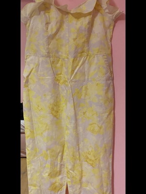 Milkwhite jumpsuit yellow with patterns and ruffles size medium like new