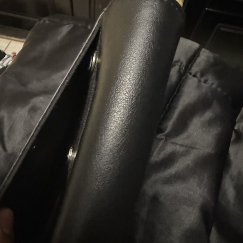Minimal black handbag with unique closure like new