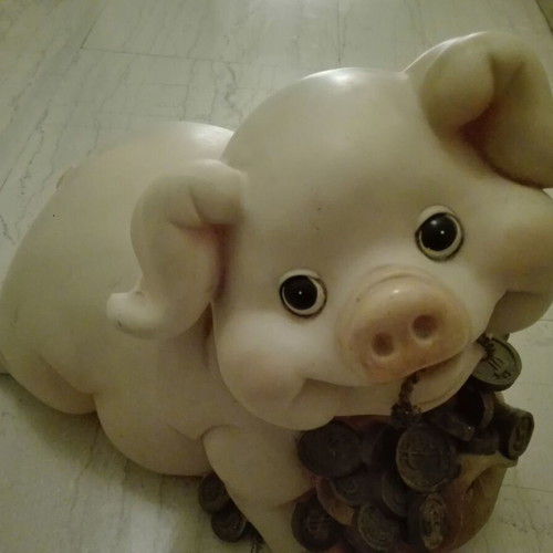 Piggy bank vintage used with gold coins