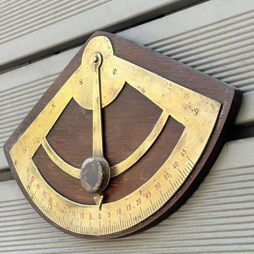 Vintage wooden wall protractor with brass details, used