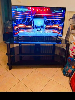 Black glass coffee table for TV