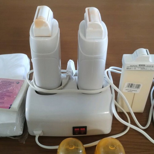 Double wax melting hair removal device like new with 3 cartridges and strips