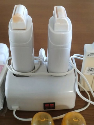 Double wax melting hair removal device like new with 3 cartridges and strips