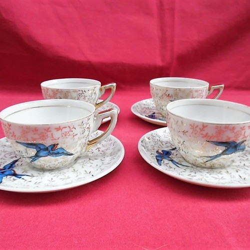 Porcelain cups with blue birds and gold designs, set of 4