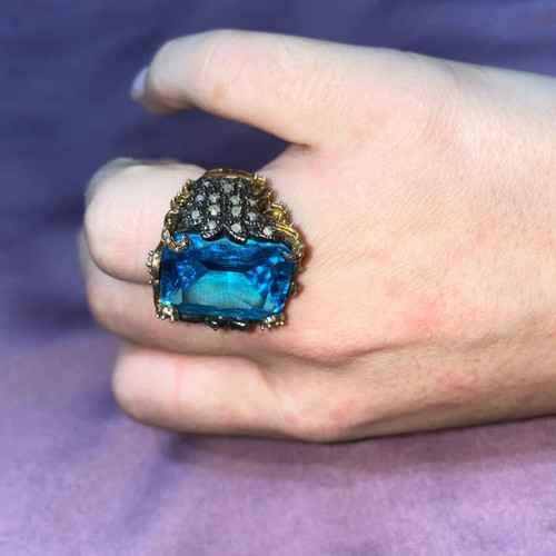 Silver ring plated with 9K gold, like new, blue topaz center