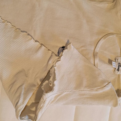 Disney top like new, beige, with ribbed pattern edges