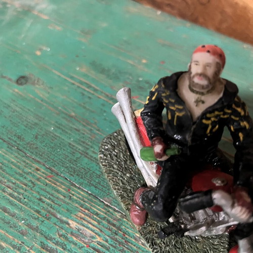 Vintage collectible biker figure on red motorcycle, like new