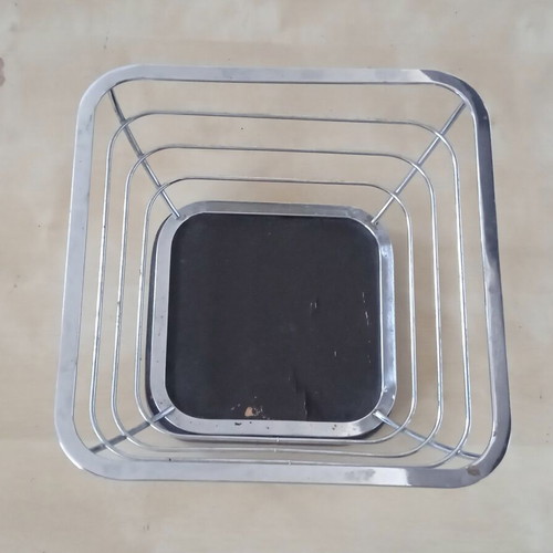 Metal fruit bowl with wooden base used