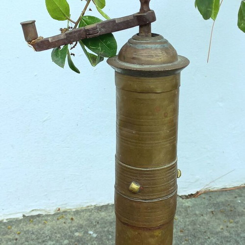 Old brass coffee-pepper grinder used