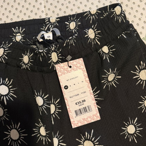My Jewellerey pants size XS, black with white sun print