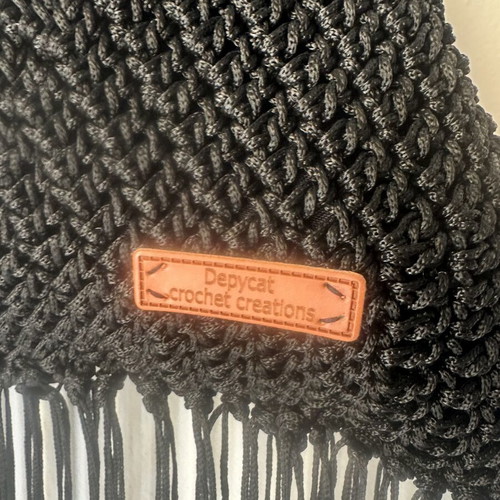 Handmade knitted shoulder bag with fringes and gold chain black
