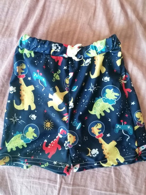 Boys' swimsuit with colorful dinosaur designs, like new, size 110 cm