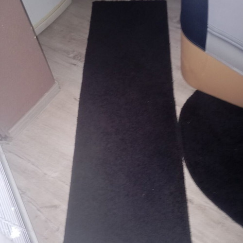 Black interior vintage runner rug used, minimalist design