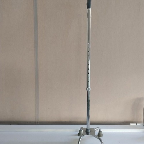Four-legged walking stick with gray handle like new