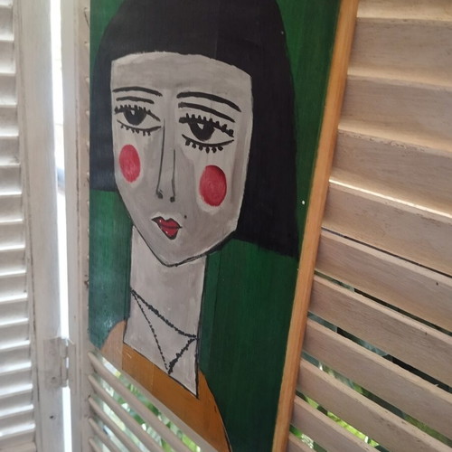 Wood painting of a face
