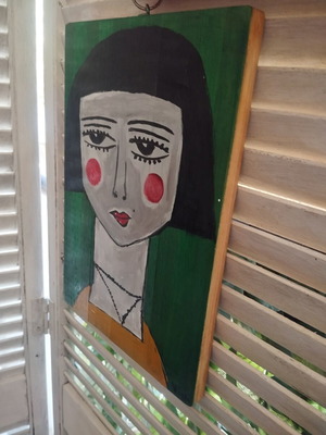 Wood painting of a face